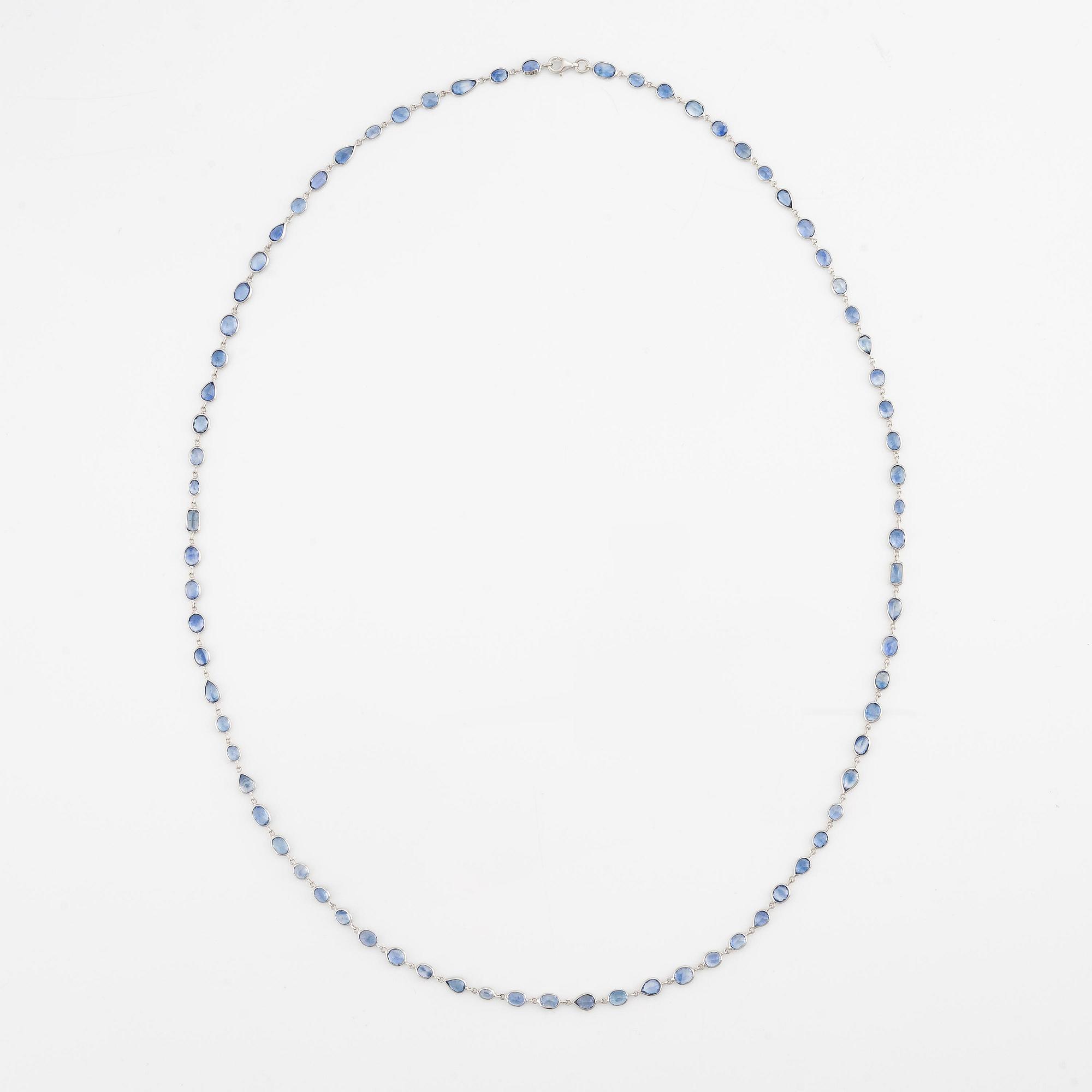 An 18K white gold necklace set  with faceted sapphires.