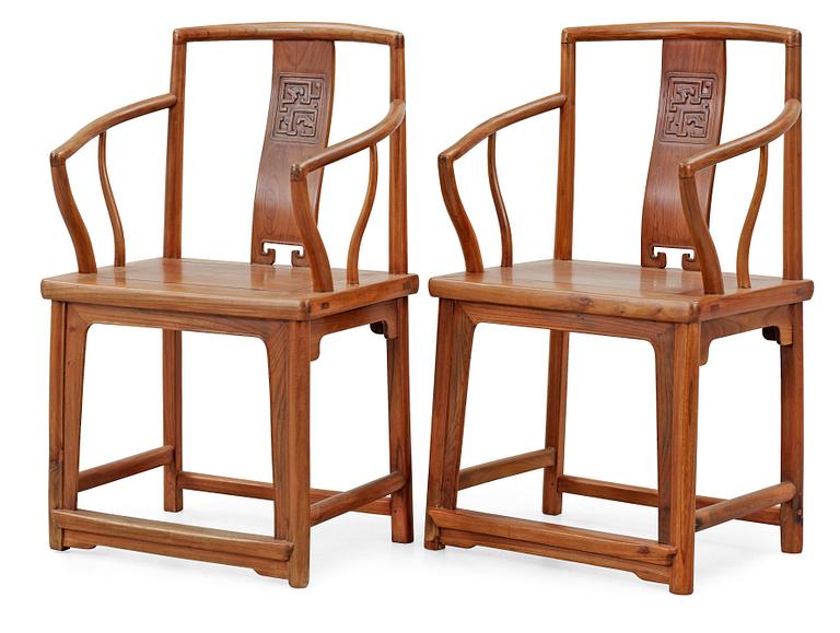 A pair of hardwood armchairs, Qing dynasty.