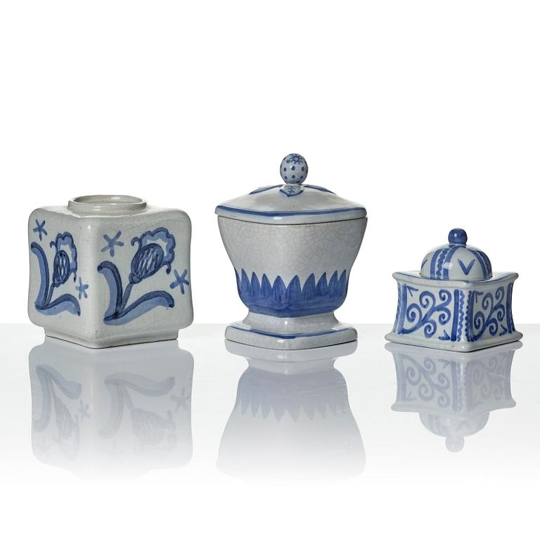 Wilhelm Kåge, eleven pieces of faience including jars, inkwells and a tulip vase, Gustavsberg, Sweden, 1919-1920.