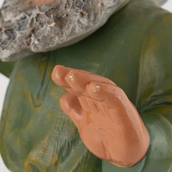 A West German earthenware gnome figurine with lantern from the second half of the 20th century.