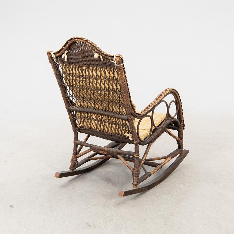 A rattan and bamboo rocking chair around 1900.
