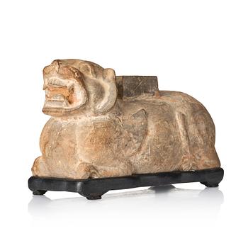 1034. A pottery model of a recumant tiger/chimera, Han dynasty (206 BC-220 AD).