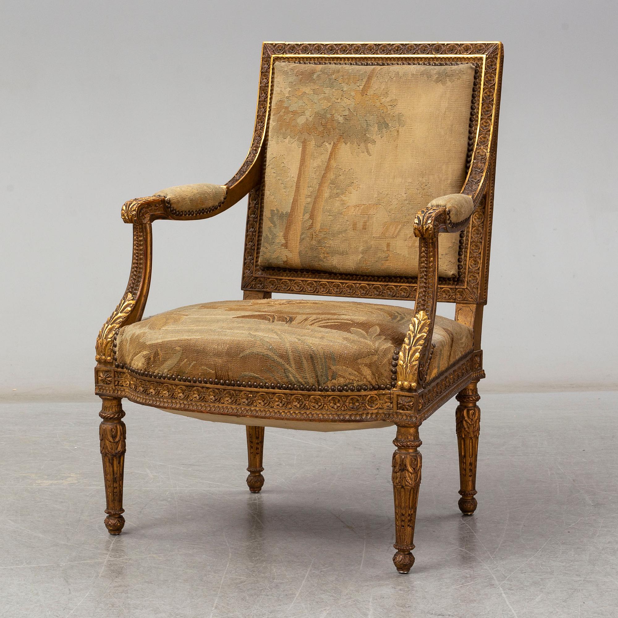 A late 19th century Louis XVI-style armchair.
