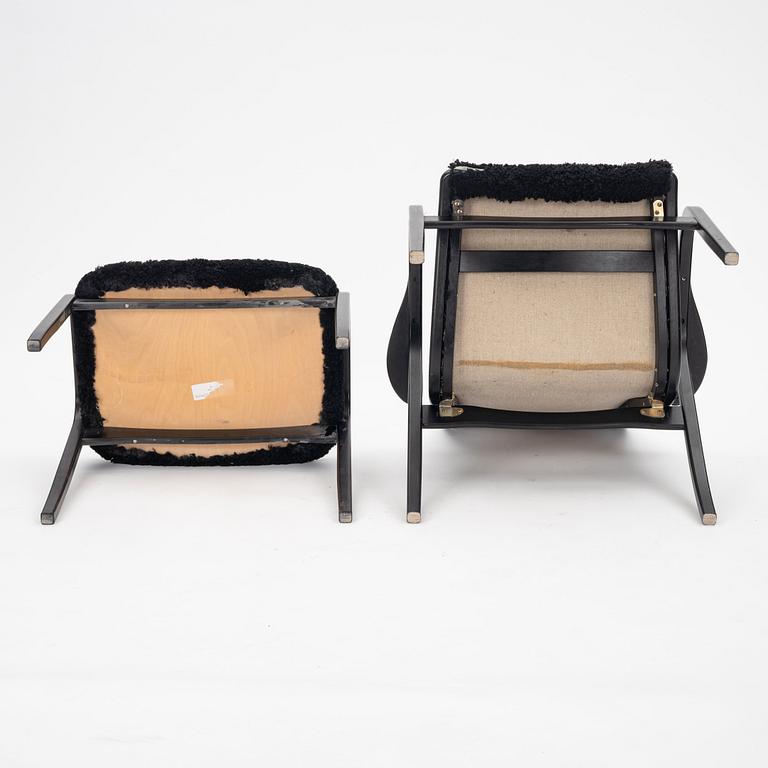 Yngve Ekström, A black "Lamino", easy chair with ottoman, Swedese, Sweden 21st Century.