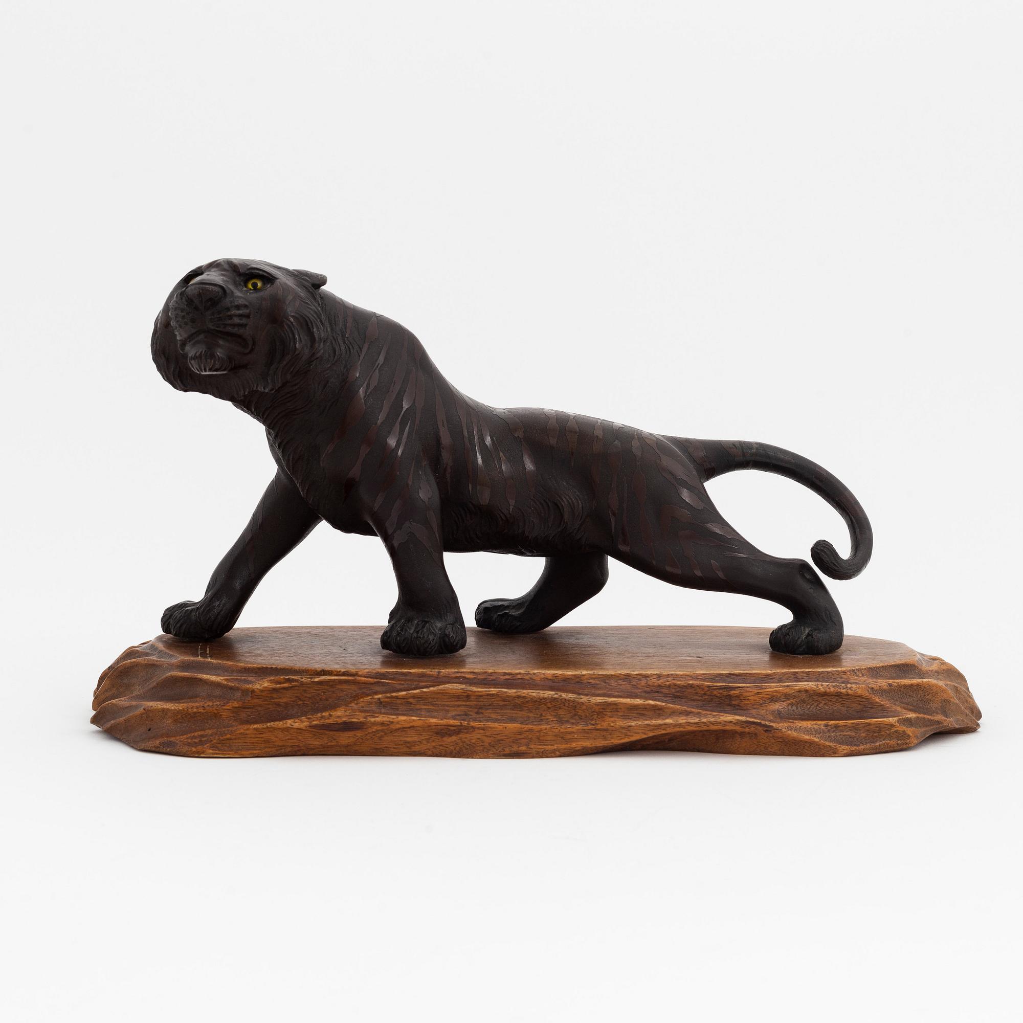 A bronze okimono/sculpture in the shape of a tiger, first half of the 20th Century.