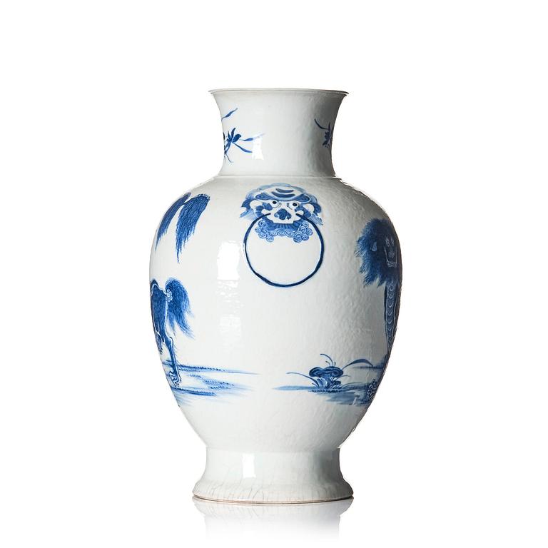 A blue and white bronze shaped vase with mythical creatures, Qing dynasty, 19th Century.