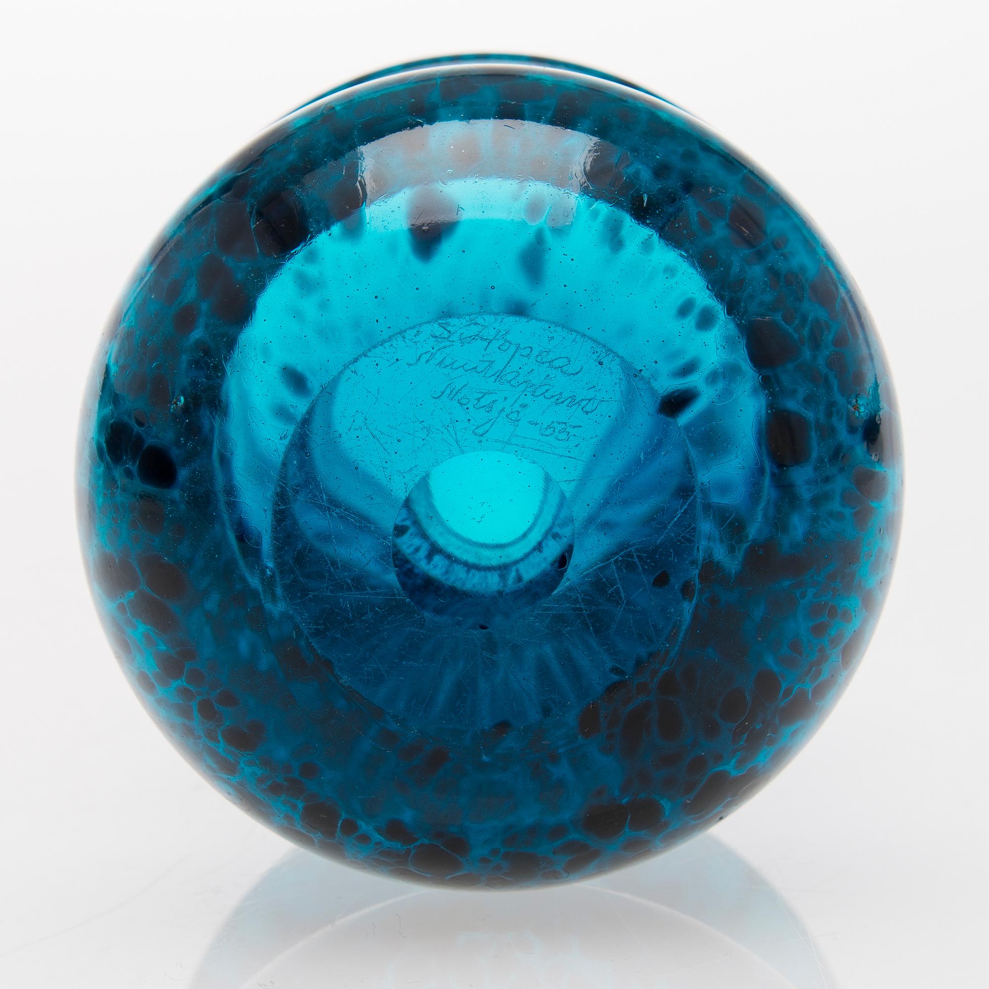 a turquoise glass vase.