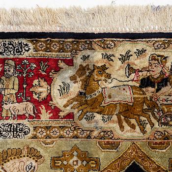 A pictorial semi-antique silk Qum rug, central Persia, c. 214 x 146 cm.