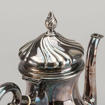 A DANISH COFFEE POT AND A SWEDISH CREAMER, silver.