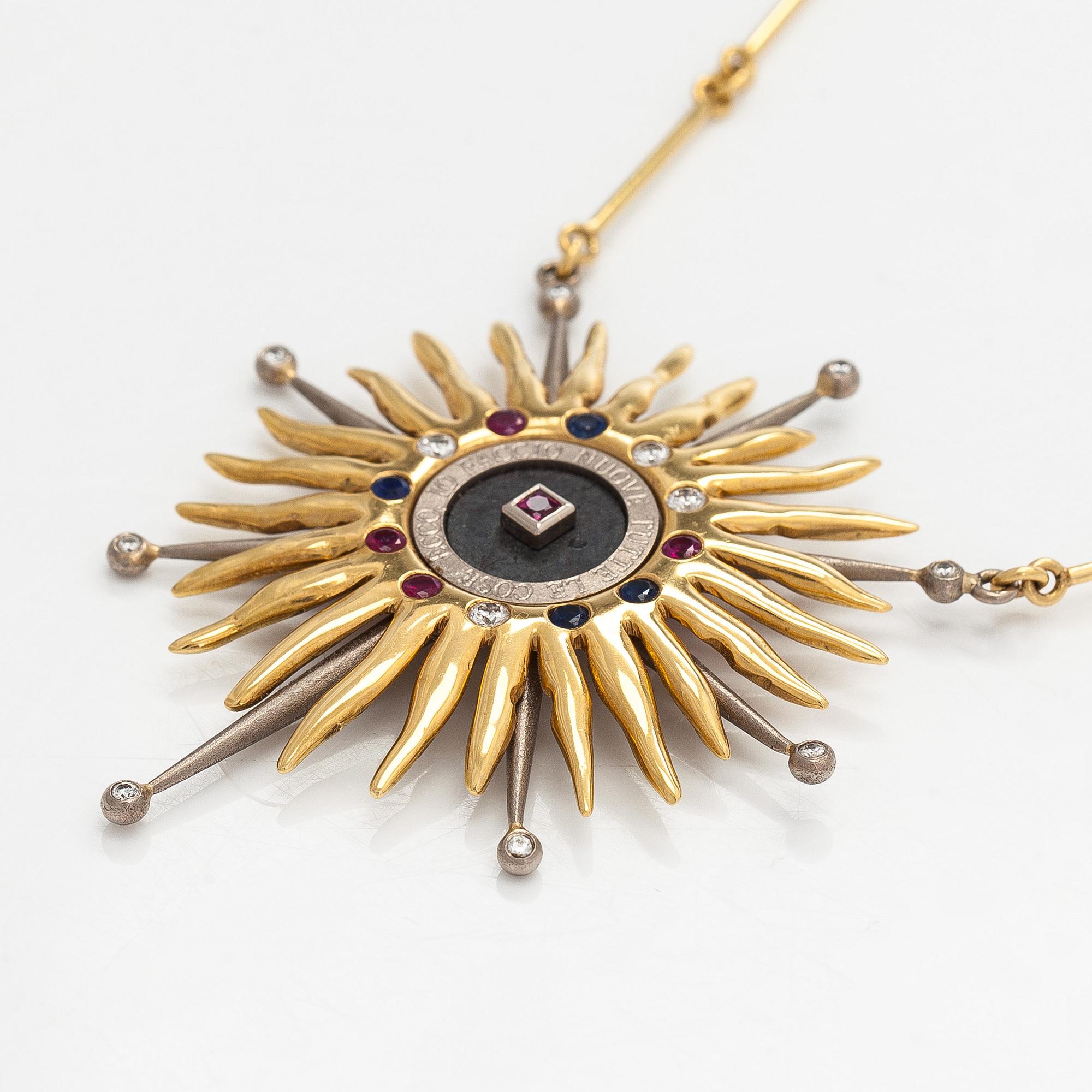 Pendant, faceted sapphires, rubies and diamonds, iron ore, 18K gold and white gold.