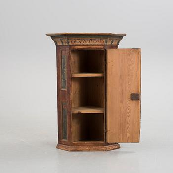 A folk corner cabinet dated 1779.