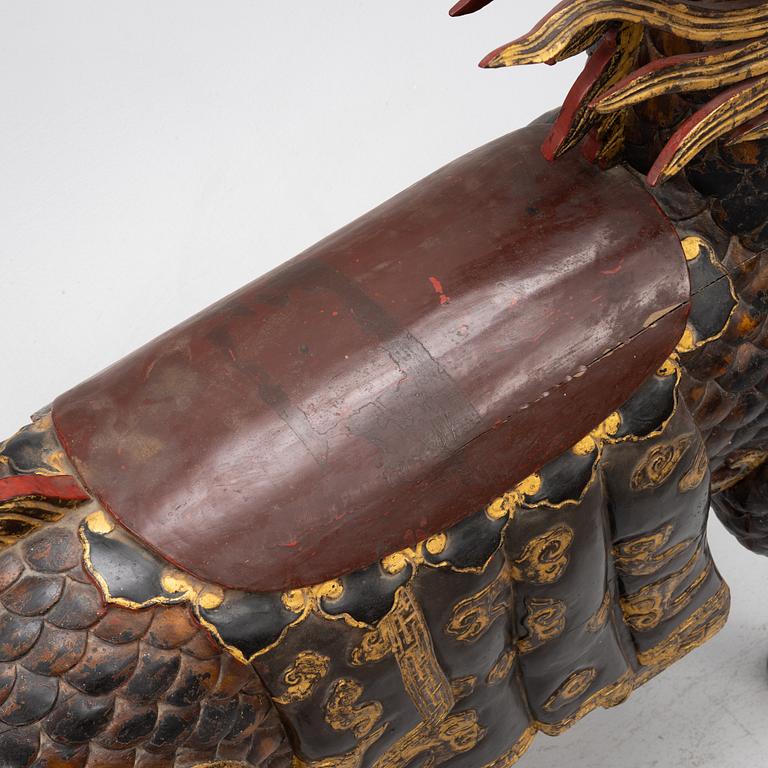 A pair of large Qilin sculptures, lacquered wood, first part of the 20th century.