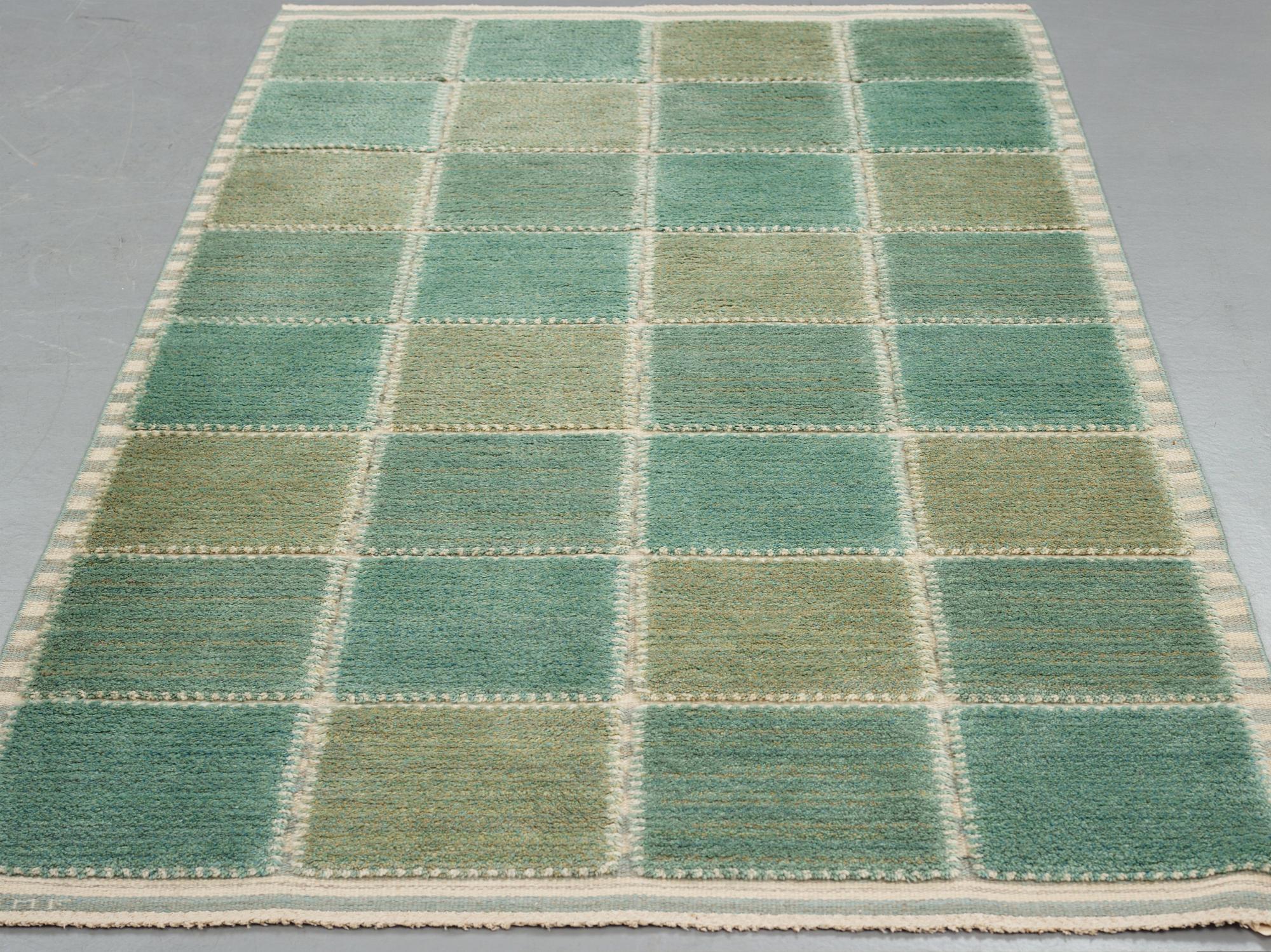 Barbro Nilsson, A carpet, "Gyllenrutan grön", knotted pile in relief ca 240,5-241,5 x 135,5-138 cm, signed AB MMF BN.
