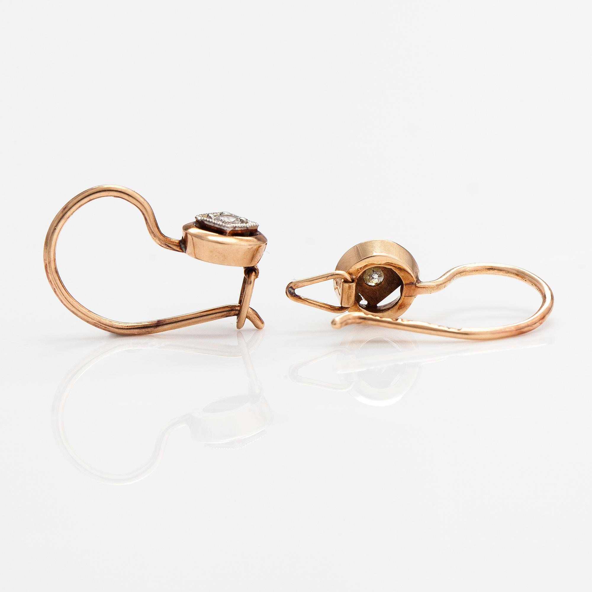 A pair of 14K gold earrings with diamonds ca. 0.06 ct tot. Finland.