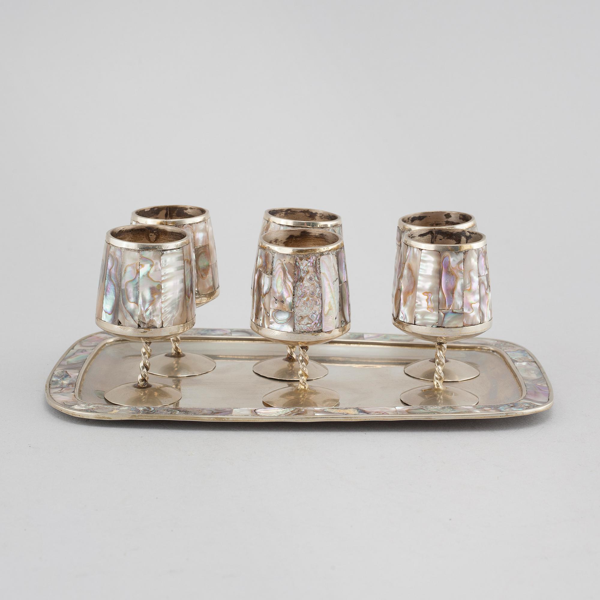 Six liqeur glasses on a tray, mother of pearl and alpaca, Mexico, second half of the 20th century.