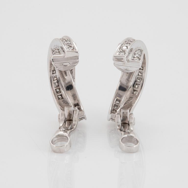 A pair of Cartier "Trinity" earrings in 18K white gold set with round brilliant-cut diamonds.