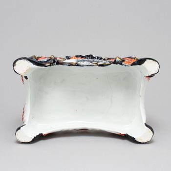A new rococo creamware bracket clock, after Meissen model, early 20th century.