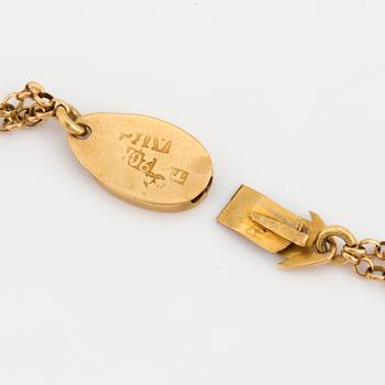 A chain and locket with hairwork.
