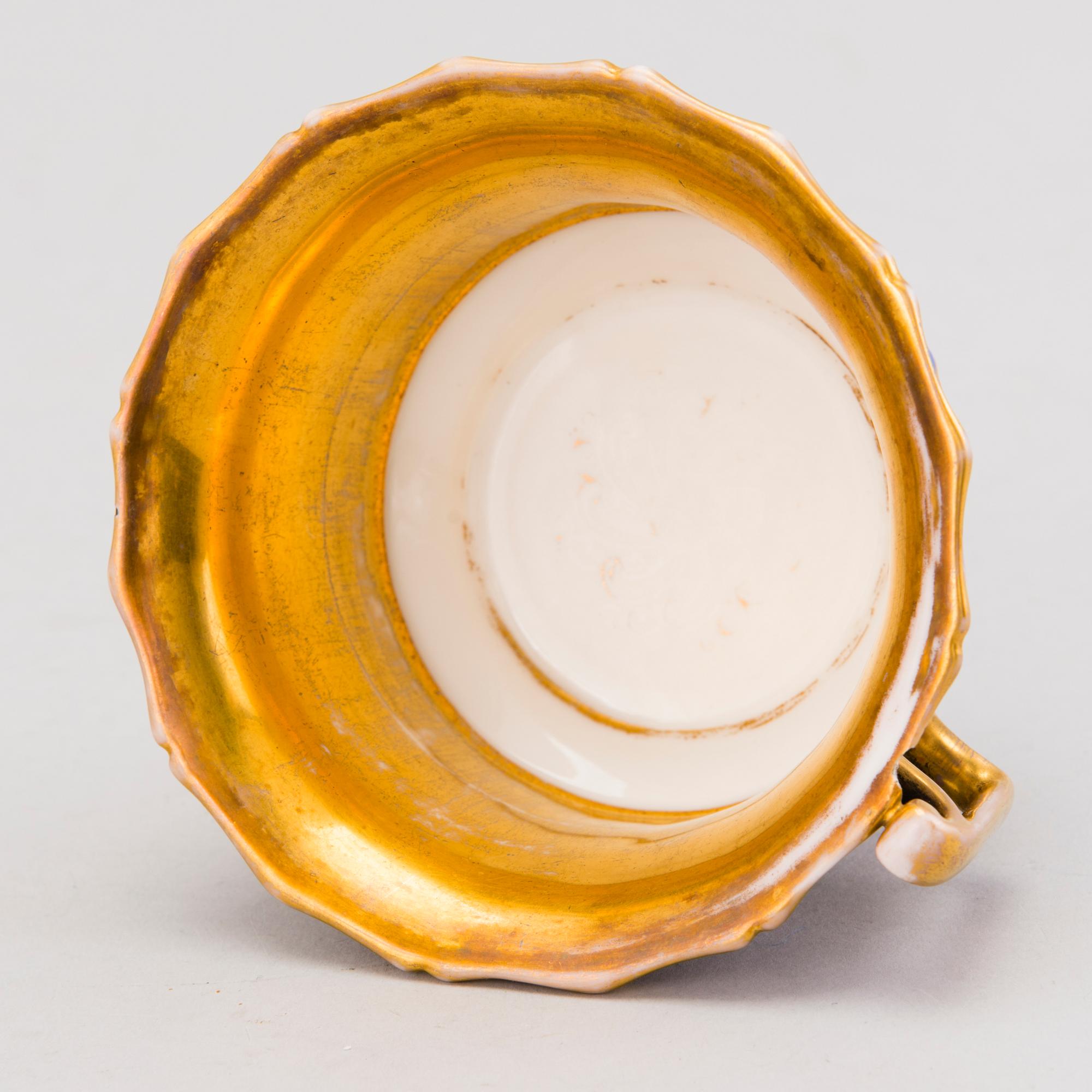 A Popov porcelain cup with saucer, Russia mid-19th Century.