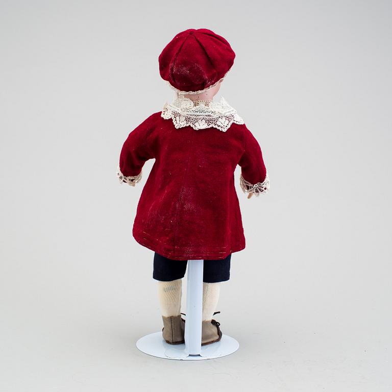 A bisque headed character boy doll, Germany, 1910s.