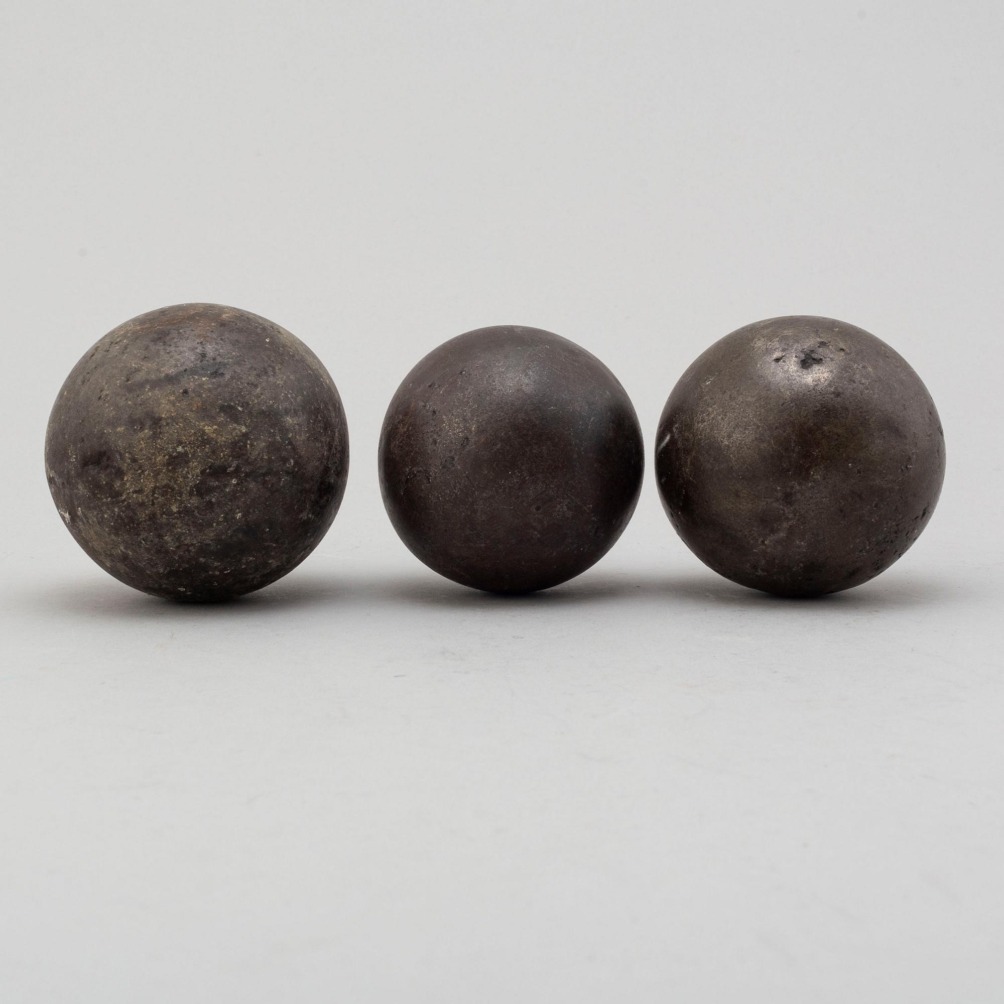 Three 19th century iron balls.