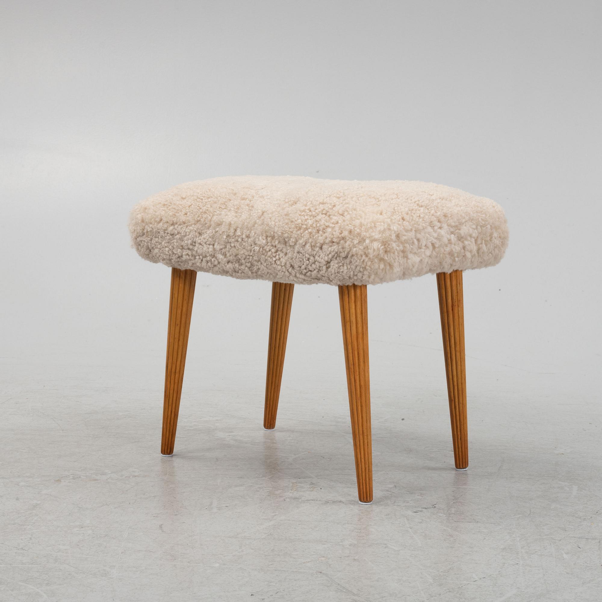 A sheepskin upholstered stool, mid 20th Century.