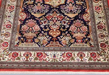 An older silk Ghom rug, 150 x 103 cm.
