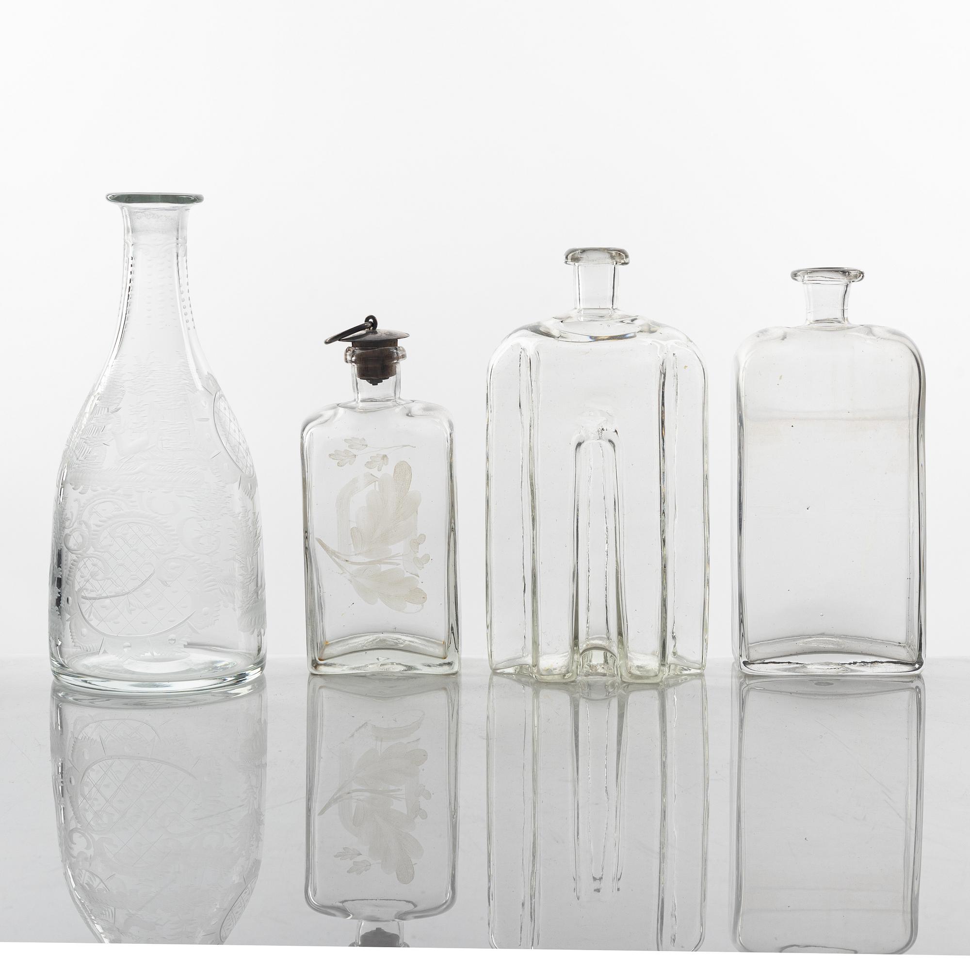 A set of three glass bottles and one decanter, 19th Century.