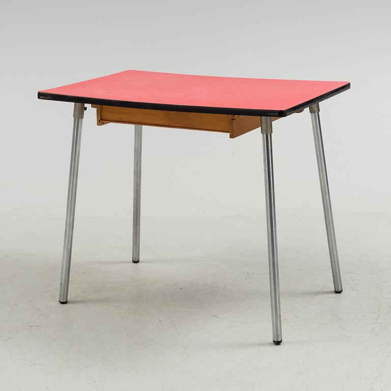 A mid 20th century table and chair.