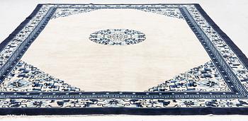 A semi-antique/old Chinese carpet, c 320 x 232 cm.