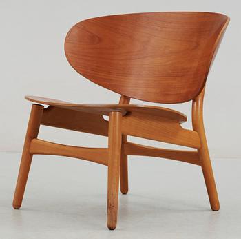 A Hans J Wegner teak and beechwood 'shell chair', Fritz Hansen, Denmark 1950's.