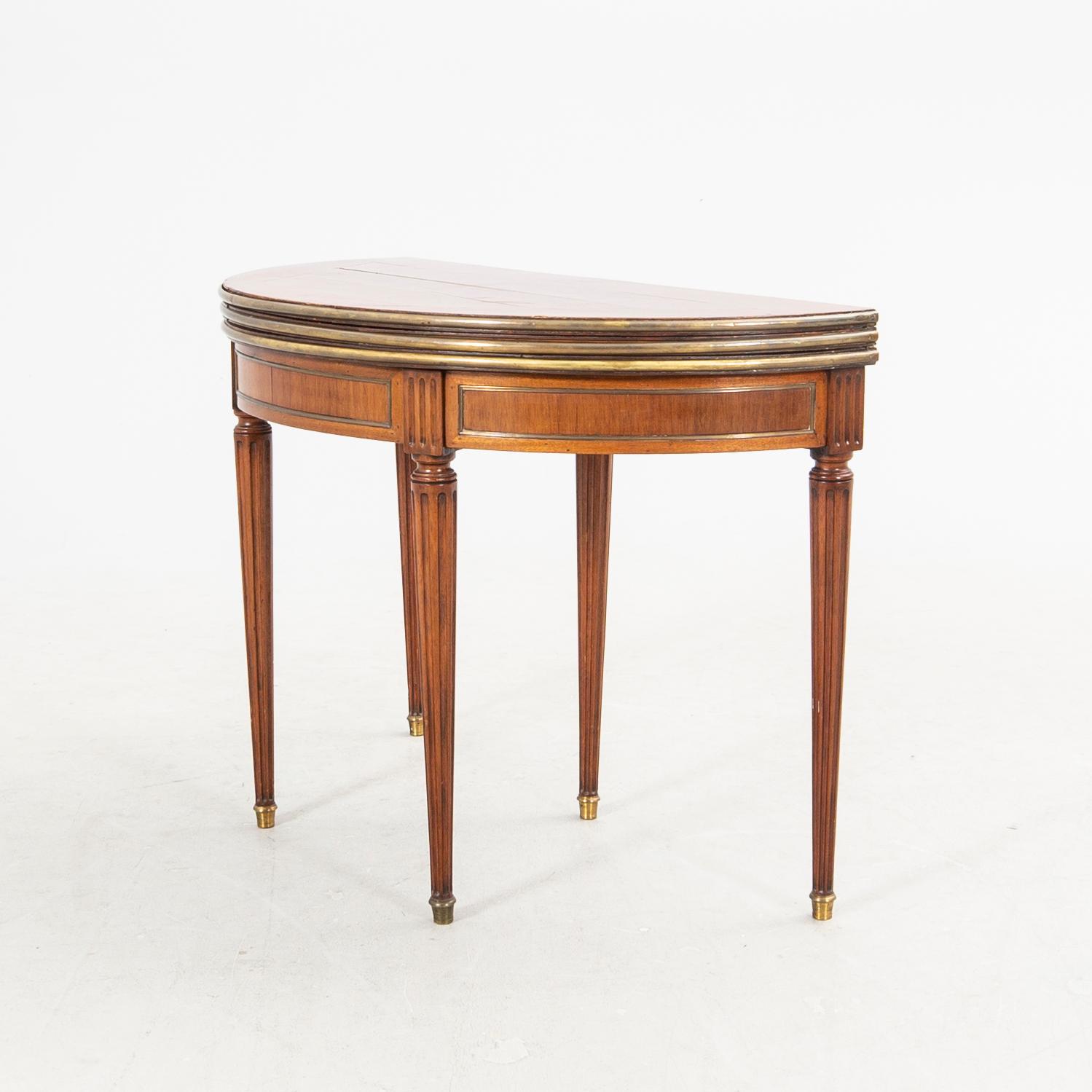 An erarly 1800s mahogany game table.