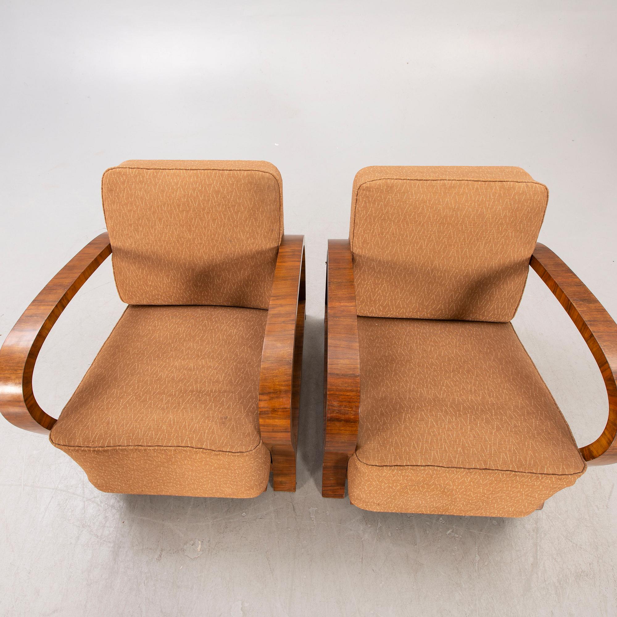 A pair of Art Deco walnut armchairs.