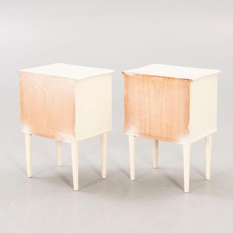 A pair of painted 1950s bedside tables.