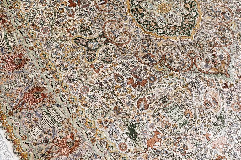 An oval pictoral silk carpet, ca 273 x 180 cm.