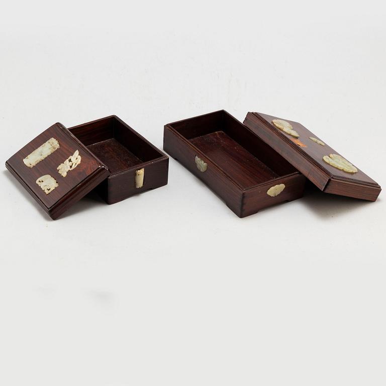 Two Chinese wooden boxes with covers, with nephrite objects, 20th century.