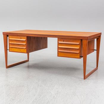 A 1960's teak model 70 writing desk by Kai Kristiansen.