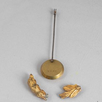 A Louis XVI style mantel clock and a pair of candelabra, circa 1900.