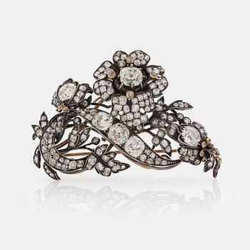 581. A late 19th century floral brooch set with old cut diamonds, total carat weight circa 10.00 cts.
