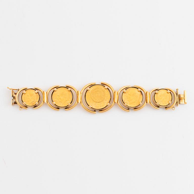 An 18K gold bracelet set with Mexican 22K gold coins.