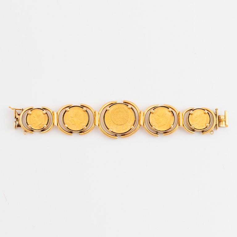 An 18K gold bracelet set with Mexican 22K gold coins.