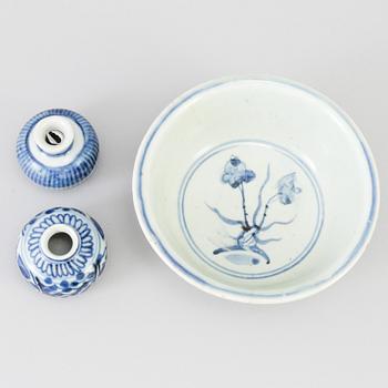 A blue and white Chinese porcelain bowl and two miniature jars for the South East Asian market, probably Ming dynasty.