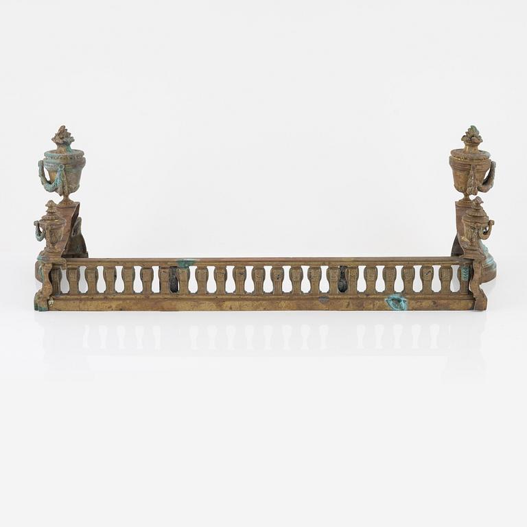 A Louis XVI style bronze grate, 19th Century.