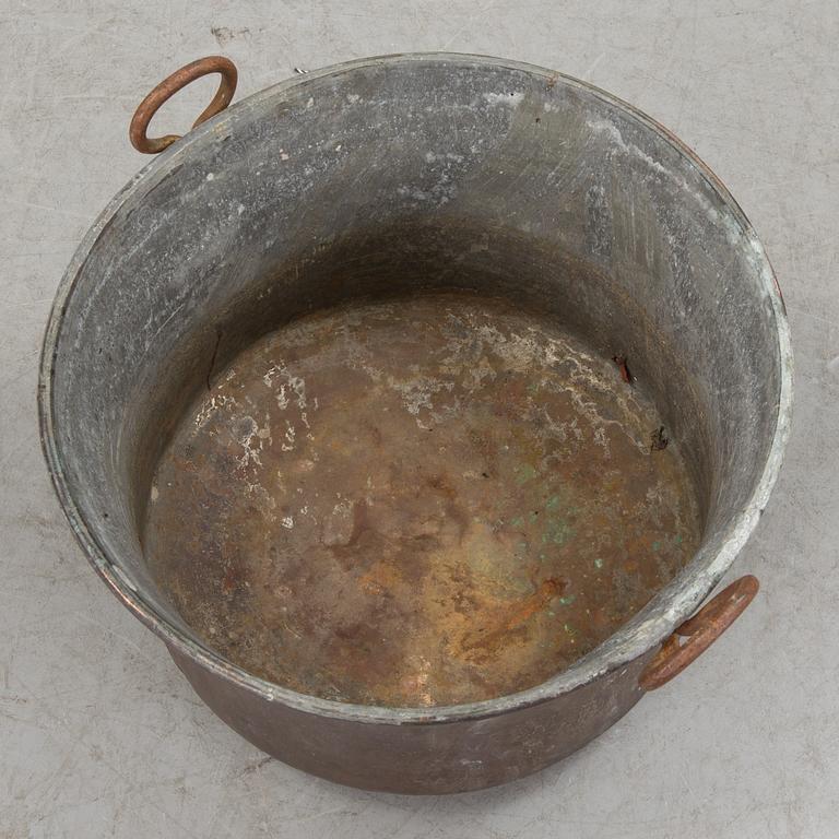 A 19th century copper cauldron.