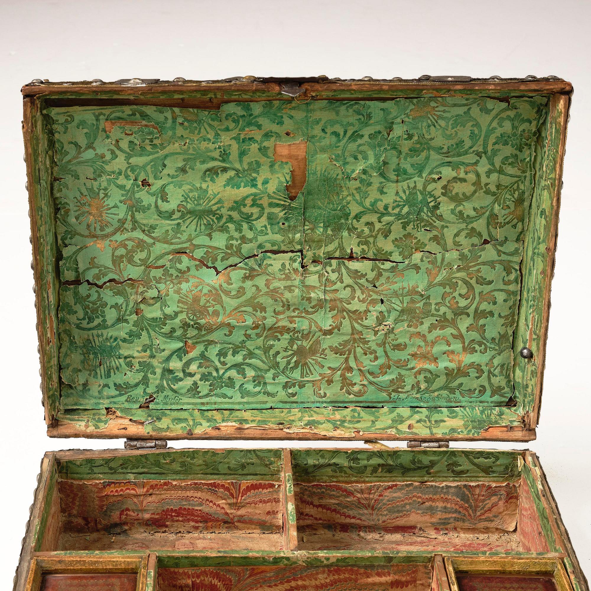 A presumably German baroque repoussé brass writing box, late 17th century.