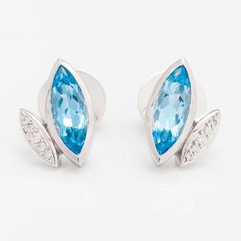 A pair of 14K white gold earrings with topazes and diamonds ca. 0.10 ct in total.