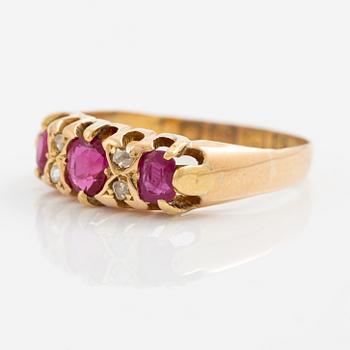 A ring 18K gold with rose-cut diamonds and red stones.