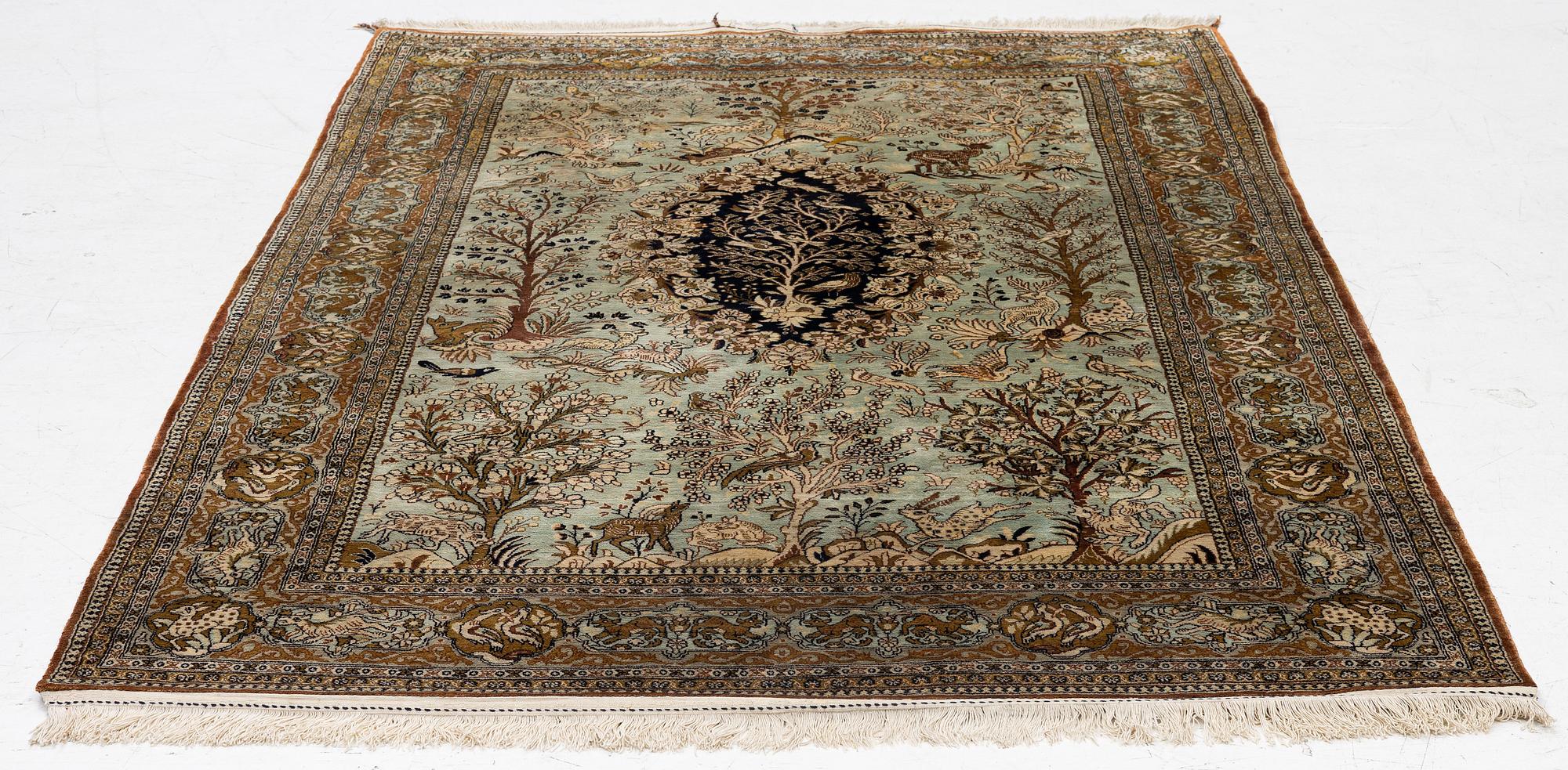 A Ghom, figural, silk rug, c. 205 x 140 cm.