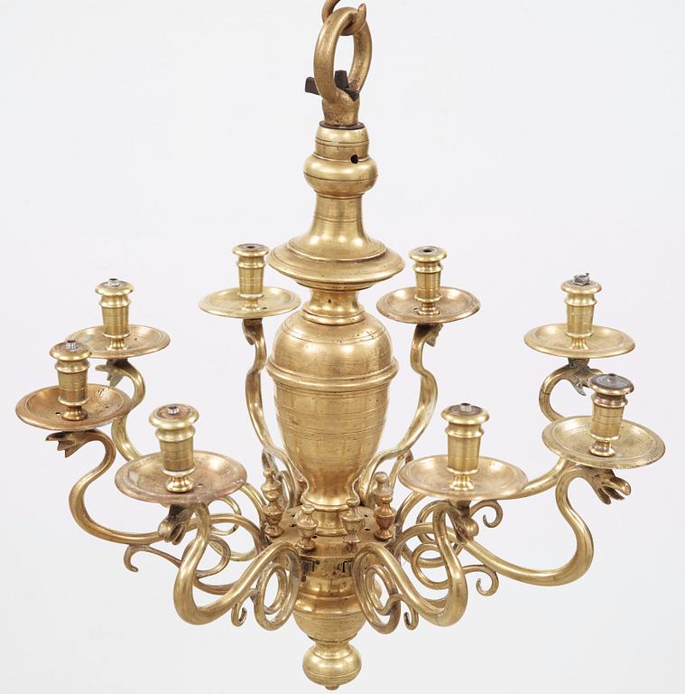 A 19th century eight-light brass chandelier in the manner of Hans Rogiers van Harelbeke.