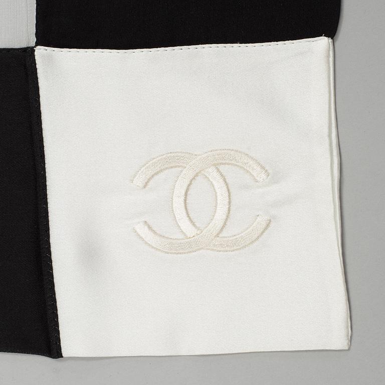 A silk scarf by Chanel.